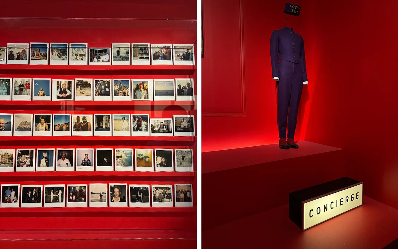 Exposition Wes Anderson à la Cinémathèque : mur de polaroïds et costume du Lobby Boy près d'une enseigne Concierge